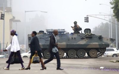An armed soldier patrols a street in Harare, Zimbabwe 

(AP Photo)
