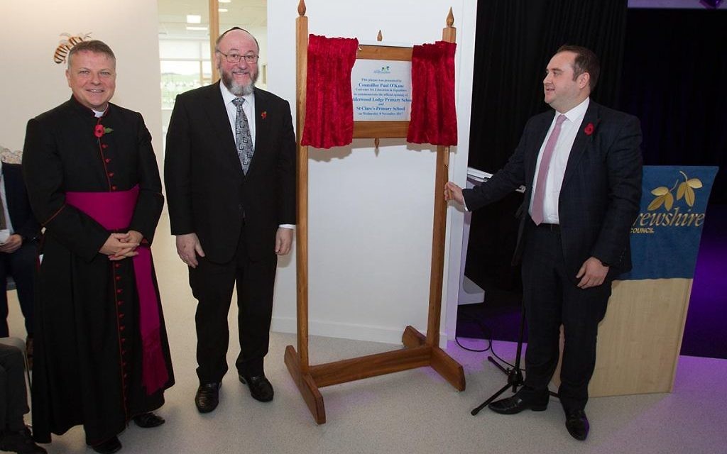 Chief Rabbi Ephraim Mirvis and Bishop John Keenan (left) unveil a plaque opening the school