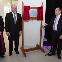 Chief Rabbi Ephraim Mirvis and Bishop John Keenan (left) unveil a plaque opening the school