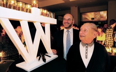 Solly Irving at a Chanukah candle-lighting ceremony with JRoots Executive Director and long-standing friend Rabbi Naftali Schiff