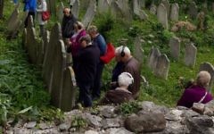 A group of visitors at Plymouths historic Jewish cemetery