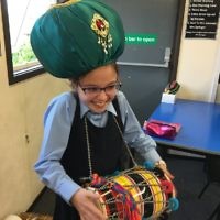 A student at  Keser Torah in Gateshead with a drum instrument