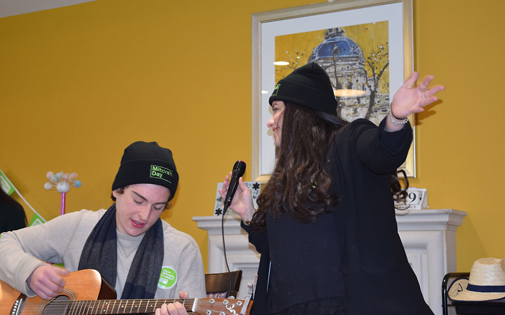 Jewish Care's Six Sunday volunteers entertaining residents at Kun Mor and George Kiss Home