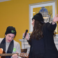 Jewish Care's Six Sunday volunteers entertaining residents at Kun Mor and George Kiss Home
