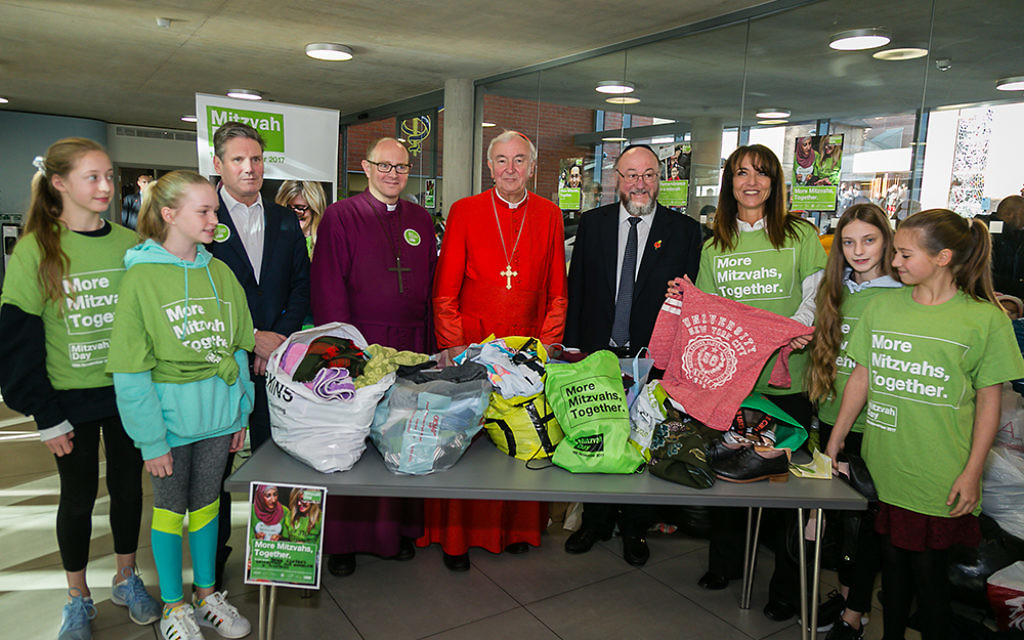 Keir Starmer, Bishop of Edmonton, Cardinal Nichols, Daniela Pears and South Hampstead school children sorting clothes for the homeless - picture by Yakir Zur