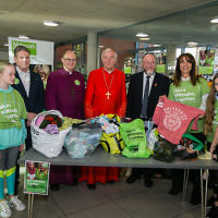 Keir Starmer, Bishop of Edmonton, Cardinal Nichols, Daniela Pears and South Hampstead school children sorting clothes for the homeless - picture by Yakir Zur