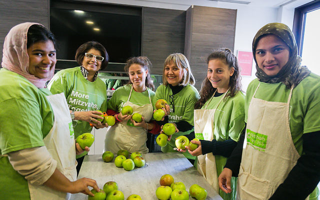 Mitzvah Day founder Laura Marks and a joint Jewish and Muslim group cook for the homeless at JW3 - Picture by Yakir Zur
