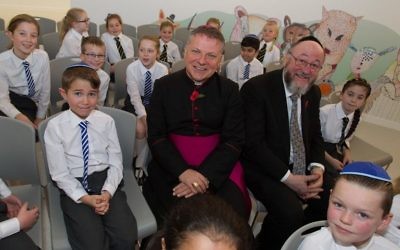 Bishop John Keenan (left) and Chief Rabbi Ephraim Mirvis (right) talk to students at the new school
