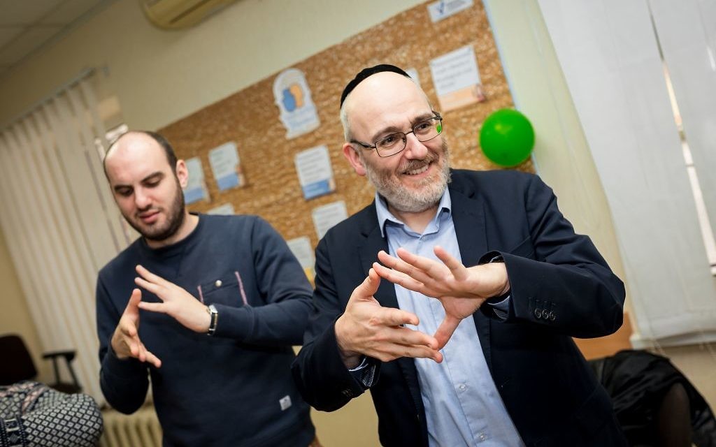Rabbi Belovski and World Jewish Relief staff member Sam Schryer take part in activities at the Jewish Community Centre in Zaporizhia, Ukraine.