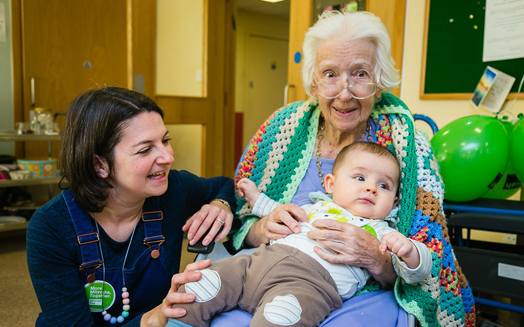 Three generations meet as Apples and Honey Nursery visit Nightingale House care home in Wimbledon - picture by Yakir Zur