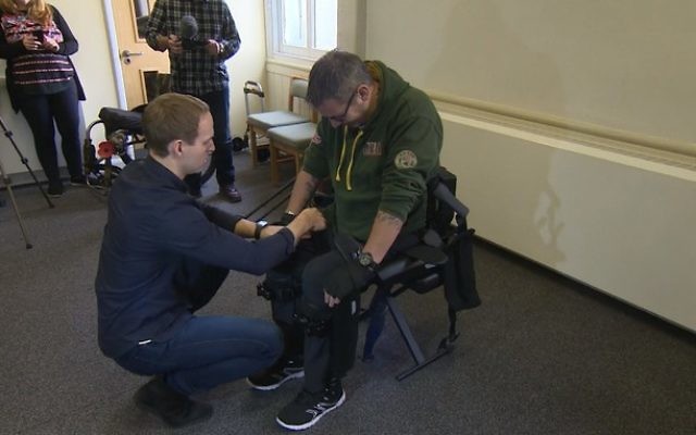 Chris Baker putting on an exoskeleton suit

Picture: Screenshot from ITN