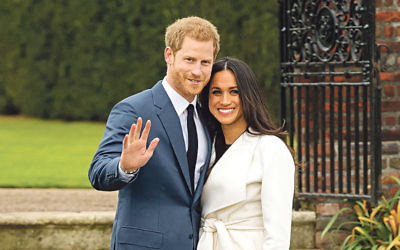 Prince Harry and Meghan Markle in the Sunken Garden at Kensington Palace, London, after the announcement of their engagement.
