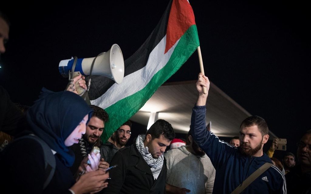 Israeli Arabs participate in a protest against the US president's decision to recognize the city of Jerusalem as the capital of Israel, in front of the American Embassy in Tel Aviv, on December 12, 2017. Photo by: JINIPIX