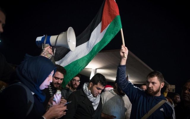 Israeli Arabs participate in a protest against the US president's decision to recognize the city of Jerusalem as the capital of Israel, in front of the American Embassy in Tel Aviv, on December 12, 2017. Photo by: JINIPIX