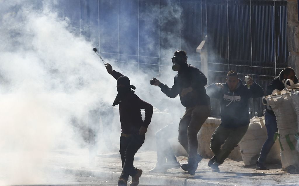 Palestinians clash with Israeli troops in December 2017 

(AP Photo/Nasser Shiyoukhi)
