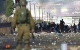 Palestinians clash with Israeli troops during a protest l in the West Bank City of Nablus,, Dec. 2017. (AP Photo/Majdi Mohammed)