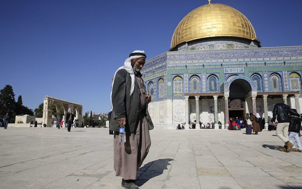 A Palestinian walks in front of the Dome of the Rock ahead of the prayers in Jerusalem, Friday, Dec. 8, 2017.  (AP Photo/Mahmoud Illean)