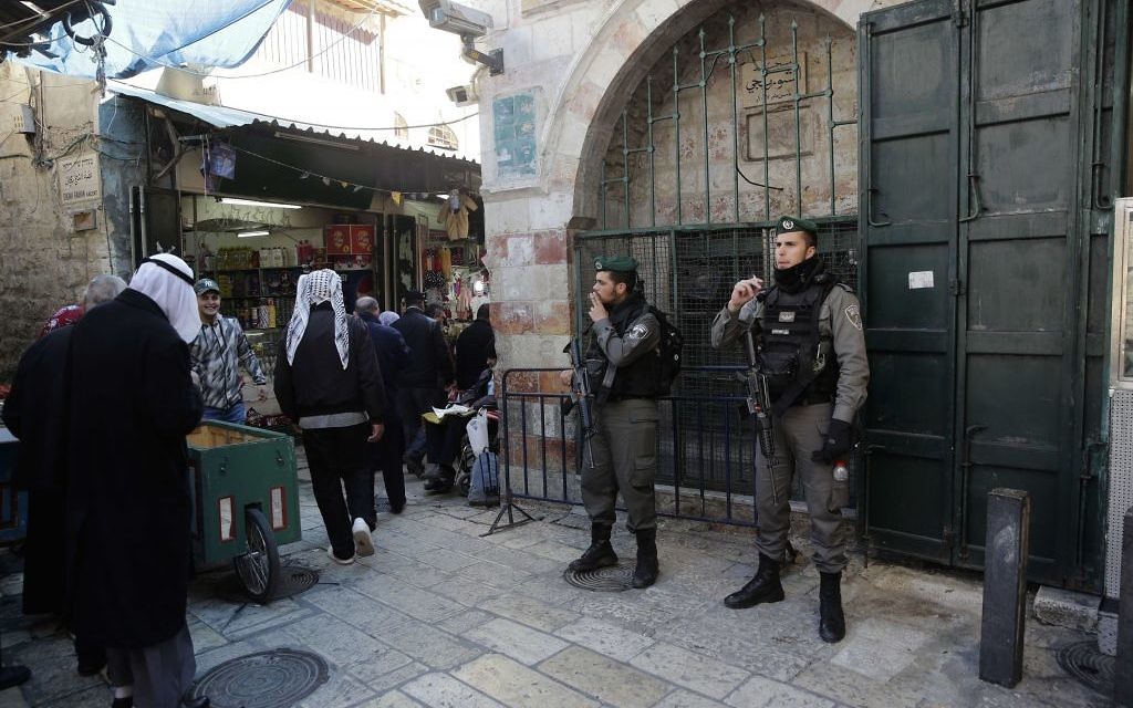 Israeli border policemen stand in Jerusalem's Old City in Jerusalem, Friday, Dec. 8, 2017. Israeli police deployed reinforcements in and around Jerusalem's Old City on Friday, in anticipation of Palestinian protests over the Trump administration's recognition of the contested city as the Israeli capital. (AP Photo/Mahmoud Illean)