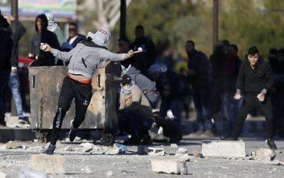 Palestinians clash with Israeli troopsl in the West Bank City 

Dec. 8, 2017.

 (AP Photo/Majdi Mohammed)