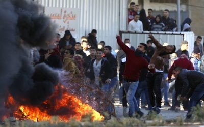 Palestinians clash with Israeli troops following a protest in the West Bank City of Nablus, 

Dec. 8, 2017. (AP Photo/Majdi Mohammed)
