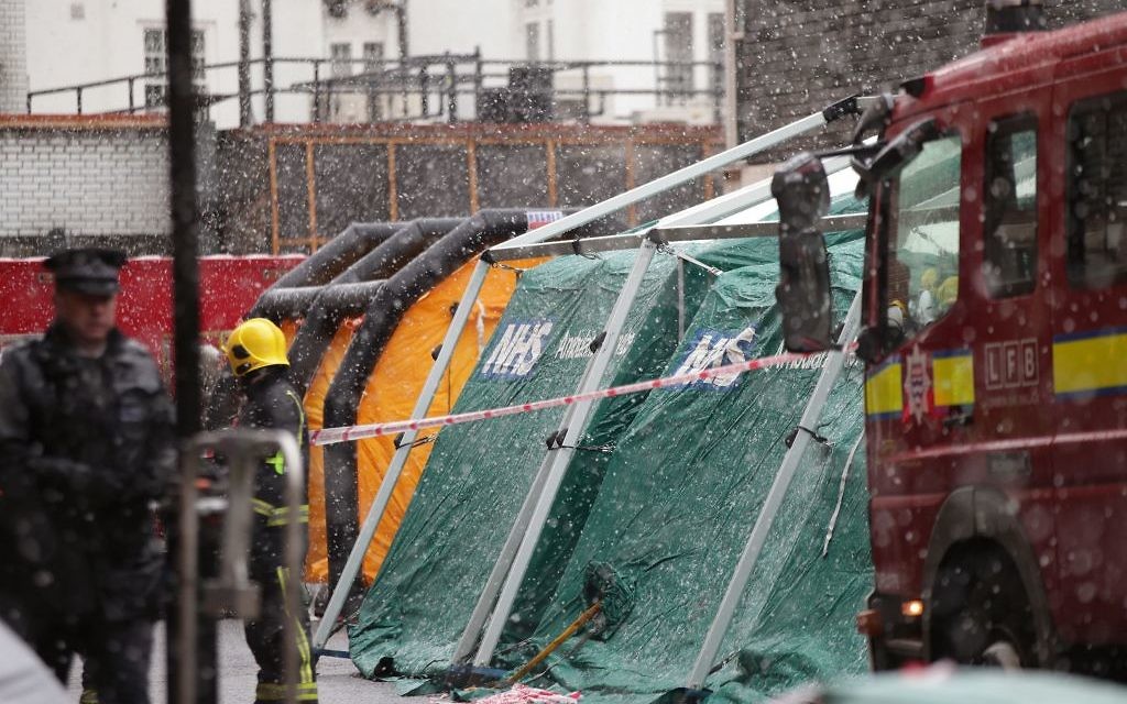 Members of the police, fire brigade and ambulance service during a joint exercise to test their response to a ÔHAZMATÕ type ncident involving a hazardous substance, at the Israeli Embassy in Kensington, London. 

Photo credit: Yui Mok/PA Wire