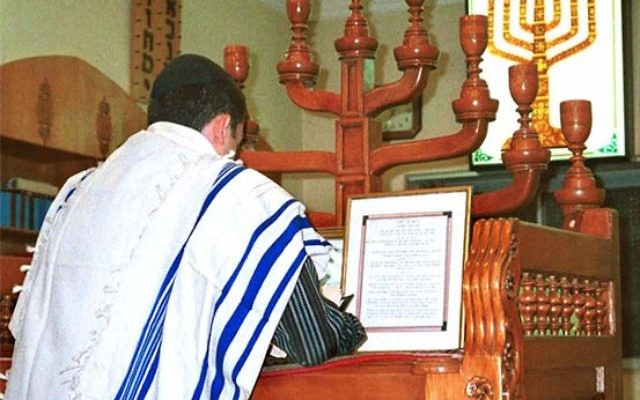 An Iranian Jew prays in a synagogue in Shiraz, Iran.
