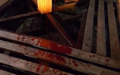 Blood splattered on the base of the menorah in Kiev. 

Credit: Reuven Stamov on Facebook