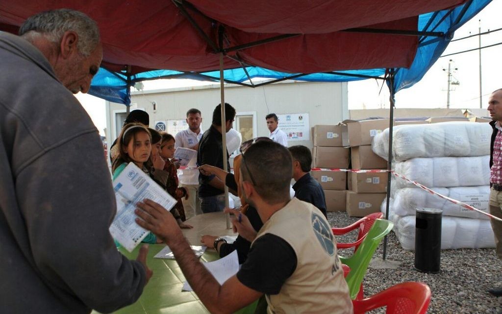 Distribution of bedding at Erbil refugee camp in Kurdistan