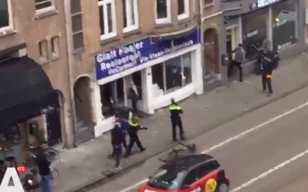 Screenshot showing the Palestinian protester smashing up a kosher shop