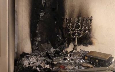 Picture of fire damage from a menorah, posted by Manchester Fire service