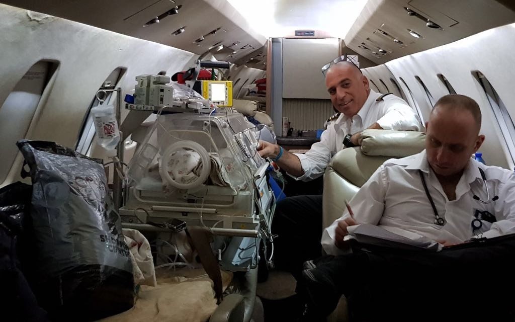 Doctors accompanying the Syrian child on a plane to Israel

(Photos - 'Aviation Bridge from Twitter)