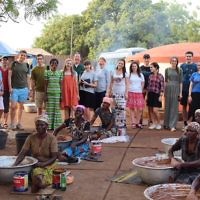A Ben Azzai group and Rabbi Daniel Epstein with Shea Butter co-op founder Joanna (in green dress) at a women’s co-op in Tamale, Ghana