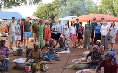 A Ben Azzai group and Rabbi Daniel Epstein with Shea Butter co-op founder Joanna (in green dress) at a women’s co-op in Tamale, Ghana