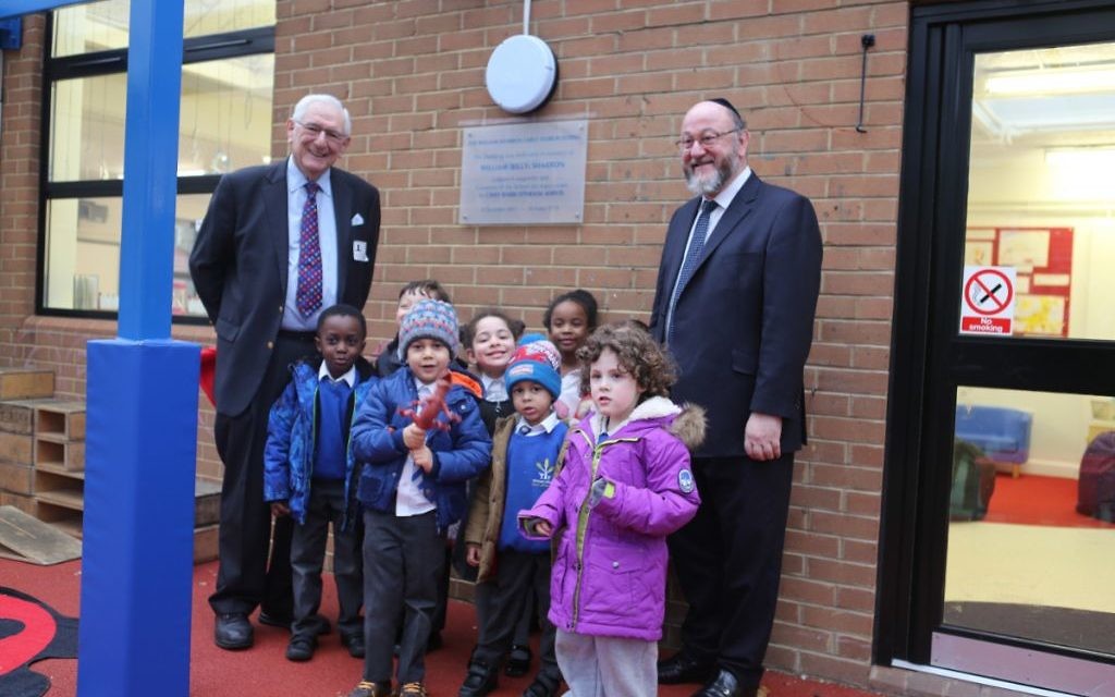 First two are the Chief with Peter Ohrenstein, trustee of Simon Marks school. and some students