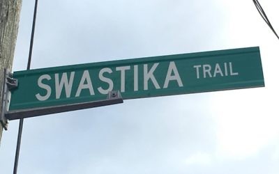 A Swastika Trail street sign hanging in Puslinch Township, Canada. (Screenshot from YouTube)