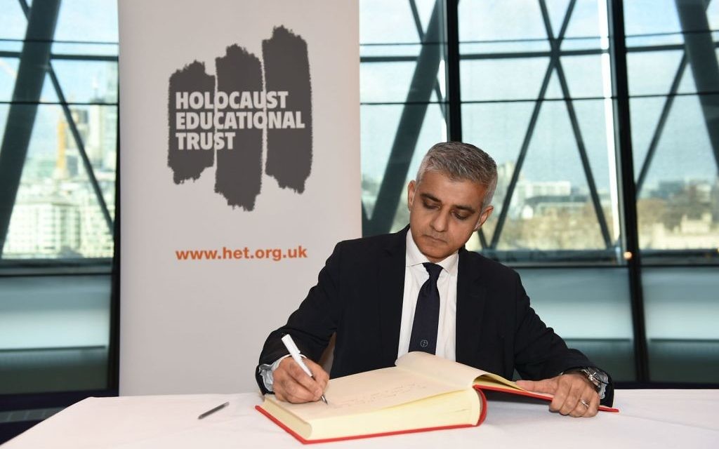 Sadiq Khan​ signs the Holocaust Educational Trust (UK)​ Book of Commitment at City Hall in 2018