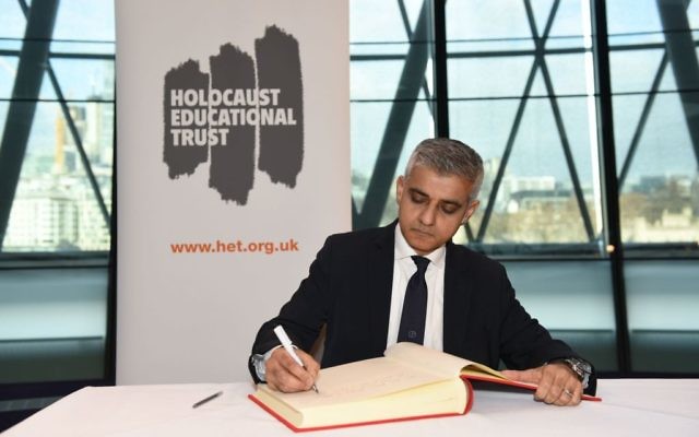Sadiq Khan​ signs the Holocaust Educational Trust (UK)​ Book of Commitment at City Hall in 2018