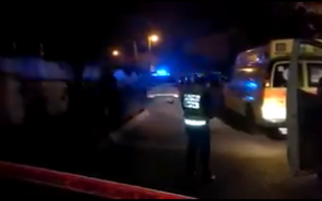 Police corner off the road where the suspected murder-suicide took place (Screenshot from Twitter)