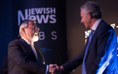Tony Blair embraces emeritus Chief Rabbi Lord Sacks as he's awarded his Lifetime Achievement honour  at the Night of Heroes 

Credit: Blake Ezra