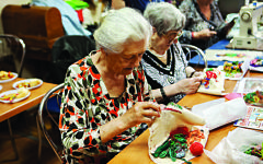 Elderly Jewish Ukrainian ladies practice traditional embroidery. Communities in Ukraine benefit from the charitable work of World Jewish Relief in alleviating poverty Elderly Jewish Ukrainian ladies practice traditional embroidery. Communities in Ukraine benefit from the charitable work of World Jewish Relief in alleviating poverty
