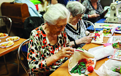 Elderly Jewish Ukrainian ladies practice traditional embroidery. Communities in Ukraine benefit from the charitable work of World Jewish Relief in alleviating poverty