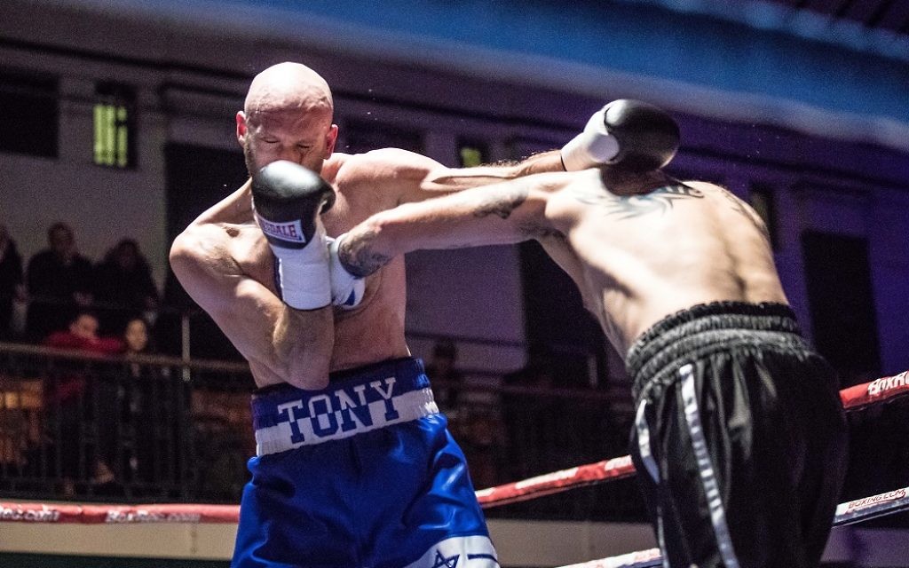 Milch, wearing his trademark Star of David shorts, lands a punch on Danny Little