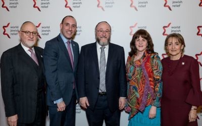 The World Jewish Relief Dinner included guests (from left): Henry Grunwald, Dan Rosenfield, Chief Rabbi Mirvis and his wife Valerie, and Linda Rosenblatt.
