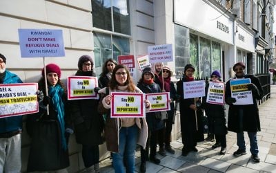 Demonstrators gather outside the Rwandan Embassy in London against Israel's controversial deportation of African asylum seekers 

Credit: Yakir Zur