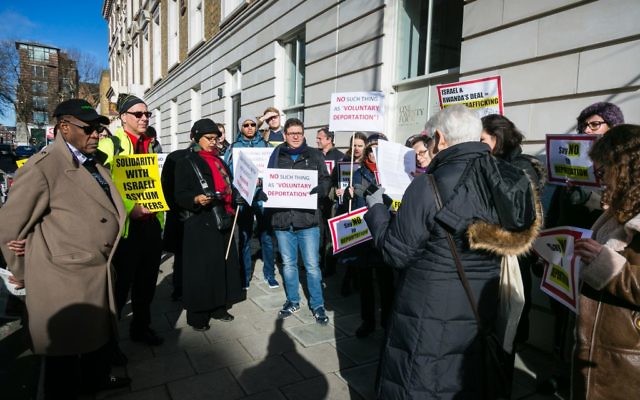 Demonstrators gather outside the Rwandan Embassy in London against Israel's contoversial deportation of African asylum seekers 

Credit: Yakir Zur