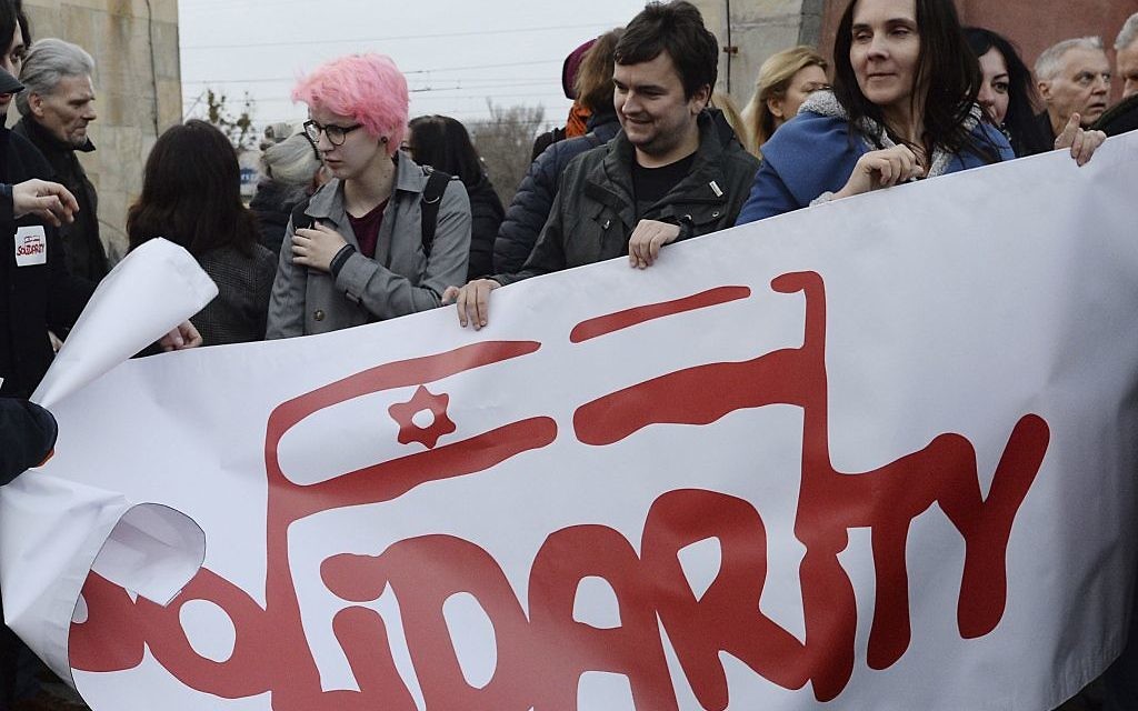 A group hold up a Solidarity banner as hundreds of Poles gathered to express their solidarity with Jews who perished in the Holocaust, were expelled from Poland 50 years ago or feel the effects of anti-Semitism today, in Warsaw, Poland

(AP Photo/Czarek Sokolowski)