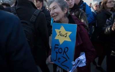Jewish Jeremy Corbyn supporter Naomi Wimborne-Idrissi, of Jewish Voice for Labour holds up a sign at the #EnoughIsEnough Demonstration against anti-Semitism, featuring a yellow star and the word Jews

Photo Credit: Marc Morris
