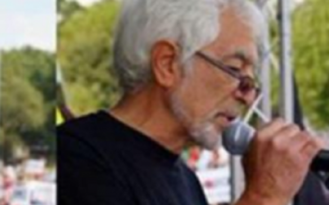 Glyn Secker's Twitter header picture shows him speaking at a pro-Palestine rally