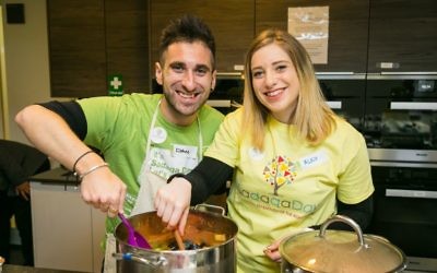 Mitzvah Day Executive Director Dan Rickman and his wife Alexandra Rickman cooking for the Sufra NW at JW3 in March 2018 - picture by Yakir Zur