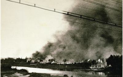 The burning Słonim Ghetto across the Szczara River during the Jewish revolt which erupted in the course of the final Ghetto extermination action, 29 June 1942